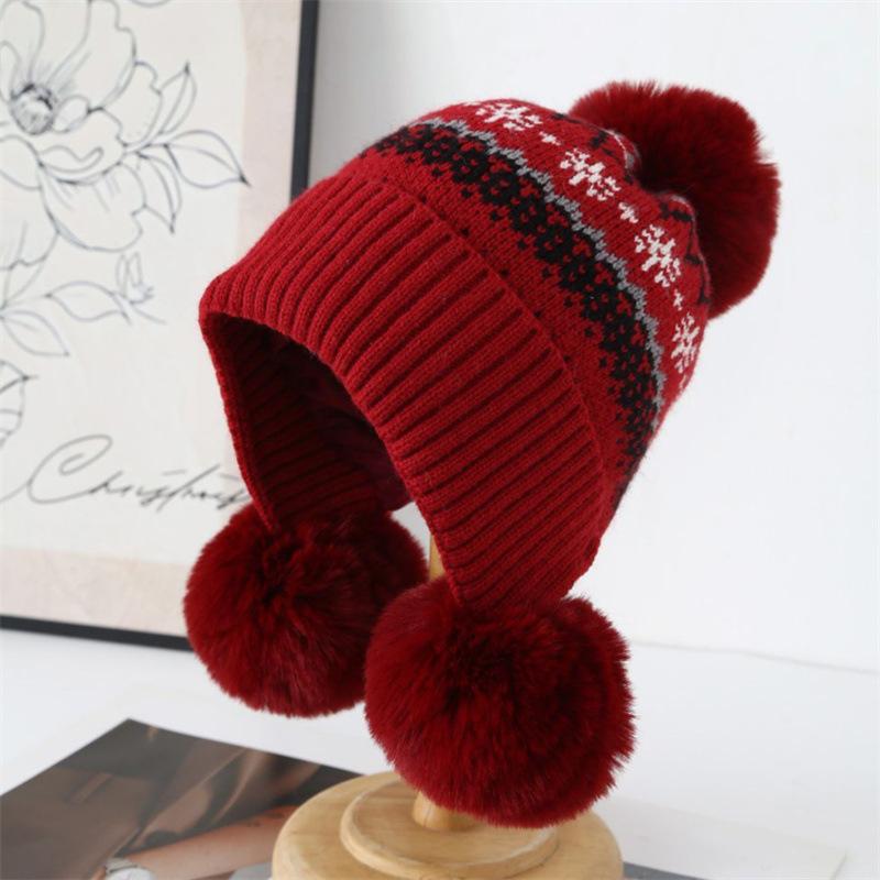 Autumn and winter jacquard knitted hat girls sweet hairball pullover hat piled and thickened Fair Island cold-proof ear protection wool hat