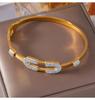 Minimalist European-American Gold-Plated Titanium Steel Bangle with Geometric Design and Diamond Detailing