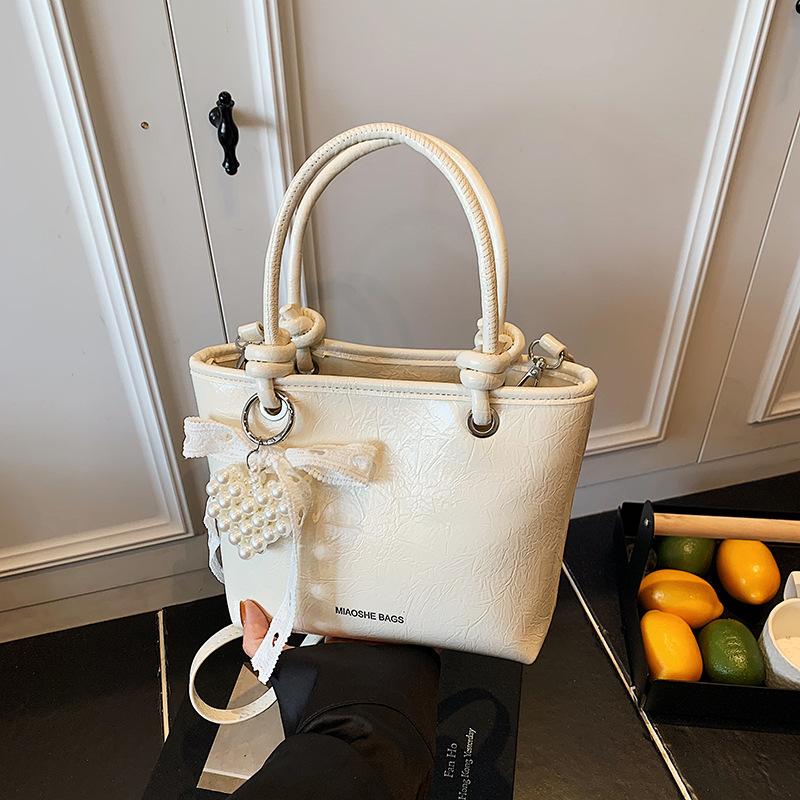 

Популярные маленькие сумки женские весна-лето 2025 новые сумки-мессенджеры модные портативные сумки-ведра