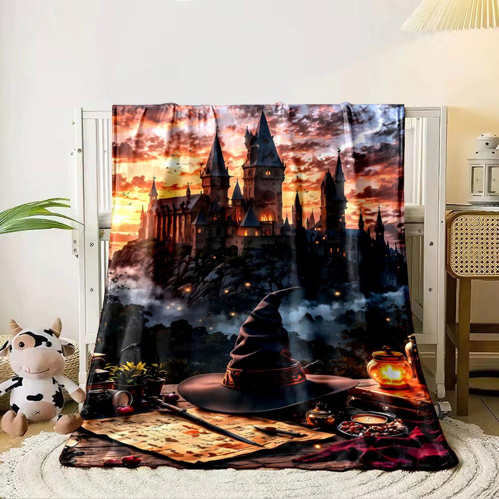 A magical castle at sunset, with a table featuring wizardly items. for all seasons blanket lunch break throw gift 80cm x 120cm