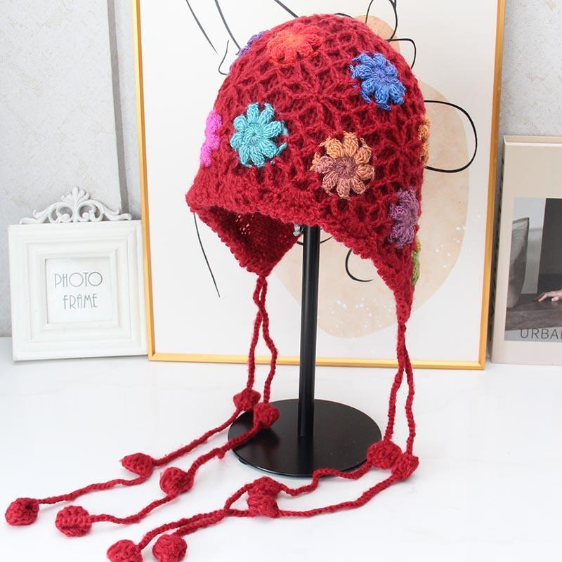 Handmade crocheted ear protection hat women's autumn and winter ethnic style colored flower knitted hat fringed strap ball bag head wool hat