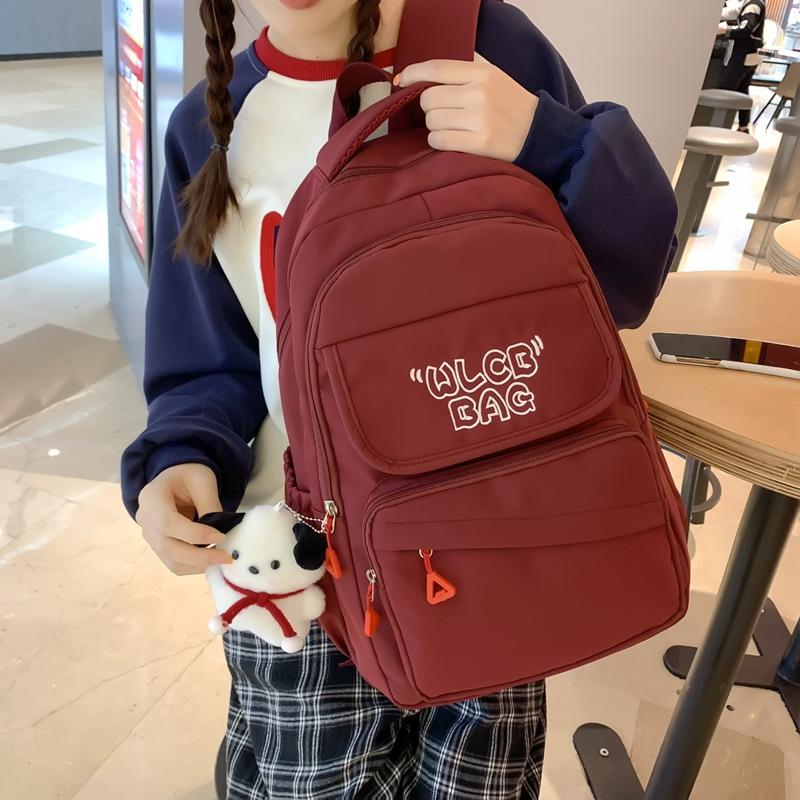 Student schoolbag 2023 new large-capacity alphabet backpack Korean version of junior high school backpack