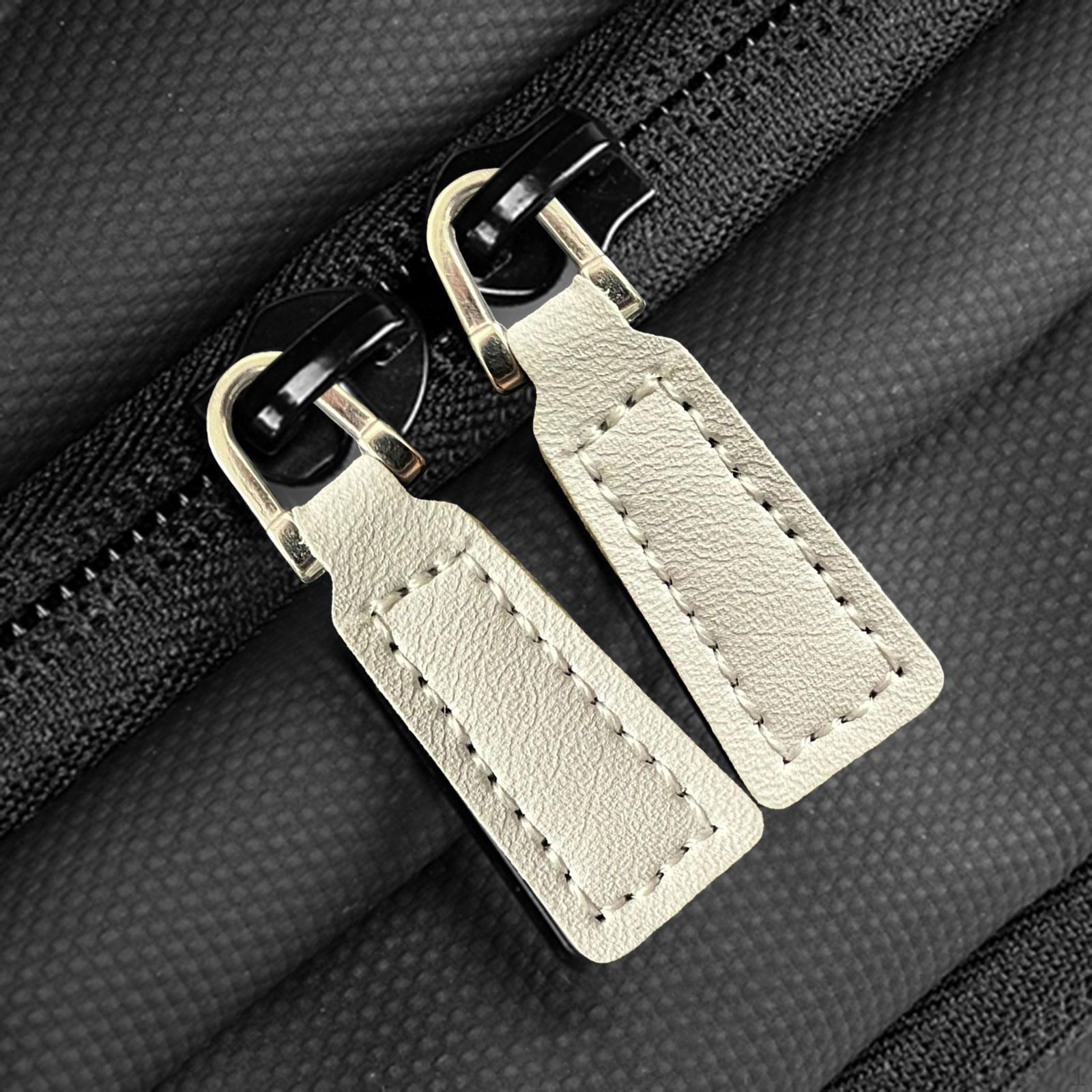 

2 пуллера на молнии из искусственной кожи, бирки для курток и сумок. Grey