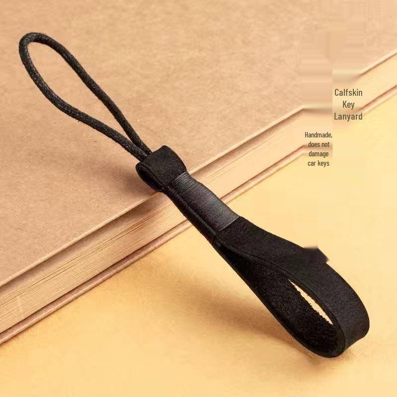 Cowhide Hand-Woven Rope Bracelet Keychain - Durable, Stylish, Car Accessory.