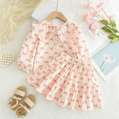 Vêtements pour enfants style coréen Nouvelle impression de nœud chemise poupée à manches longues jupe courte ensemble style printemps et automne pour filles