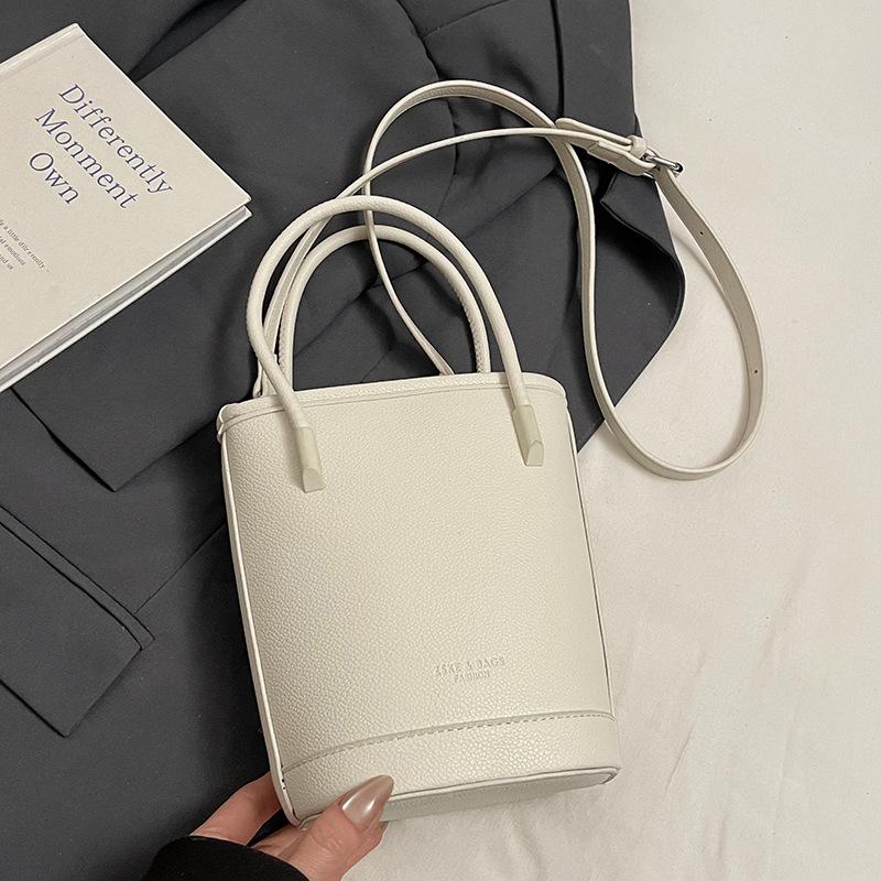 Wholesale New Products Niche Simple Solid Color Lychee Pattern Texture Hand Carry Bucket Bag Versatile Foreign Style Commuting Messenger Women's Bag