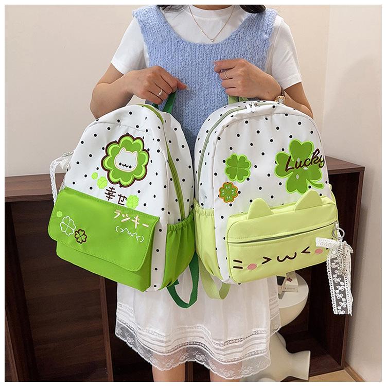 Schoolbag printed four-leaf clover backpack polka dot kitten girl light and cute versatile casual student backpack schoolbag new