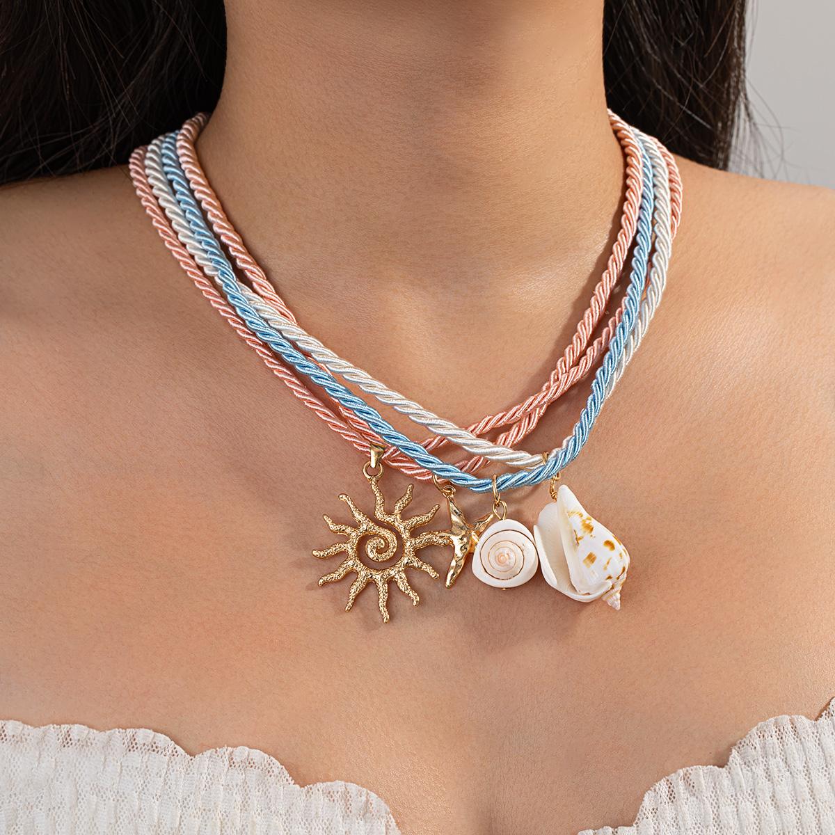

Bohemian-style multi-layer braided rope necklace with sun, conch and shell pendants, seaside vacation beach choker