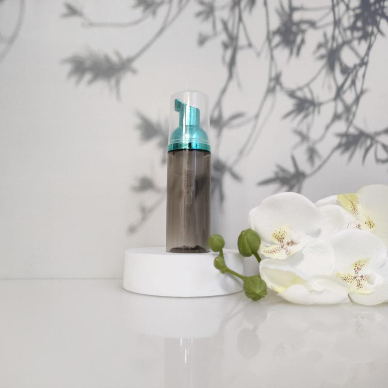 Available 60ml Transparent Black Foam Mousse Bottle for Face Wash and Travel-friendly Cosmetic Packaging.