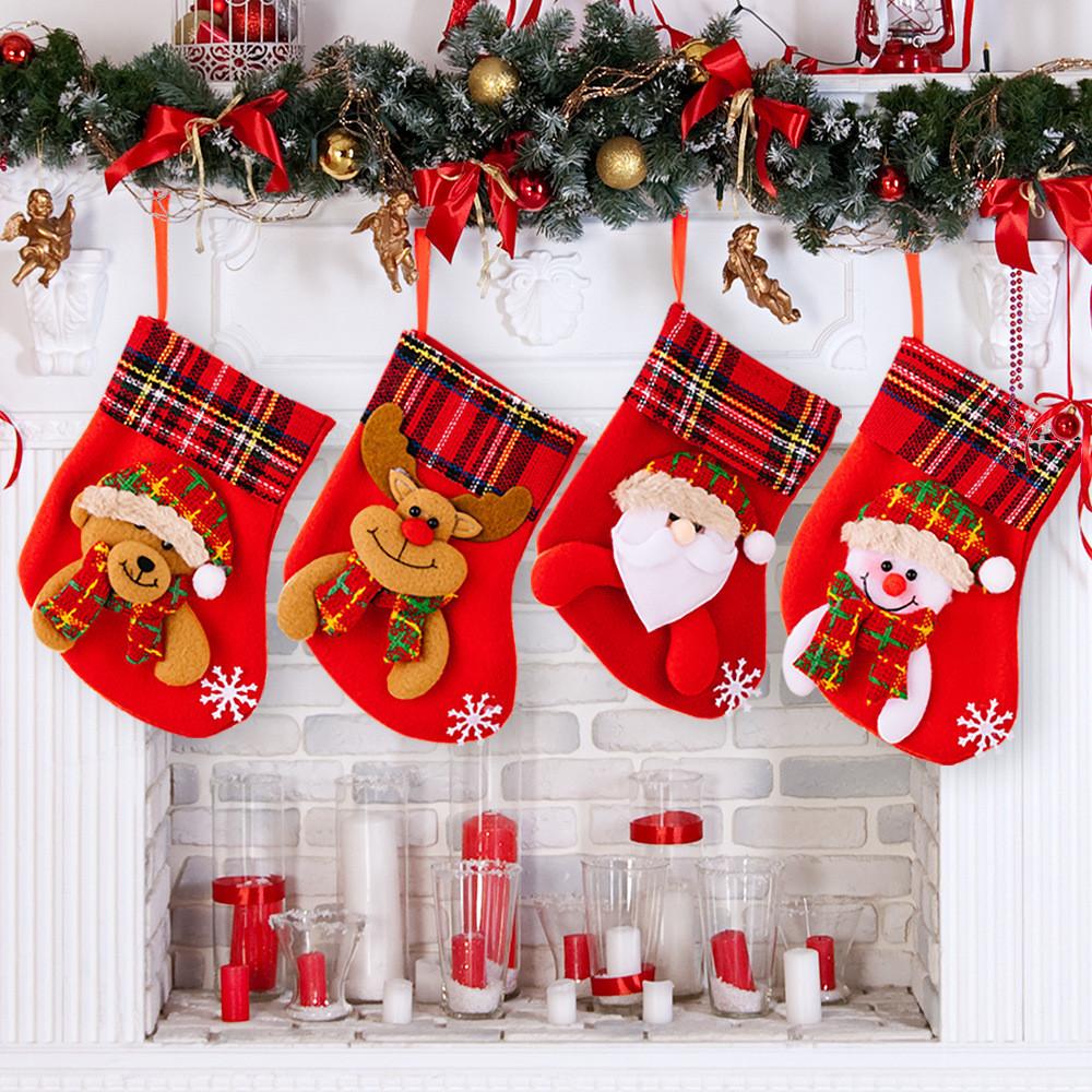 Decorative Red Christmas Stockings With Fun Cartoon Designs Of Santa Snowman Reindeer Bear For Vibrant Celebrations Festive