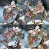 Anello aperto a forma di farfalla e fiore in lega alla moda con strass incastonati per donna