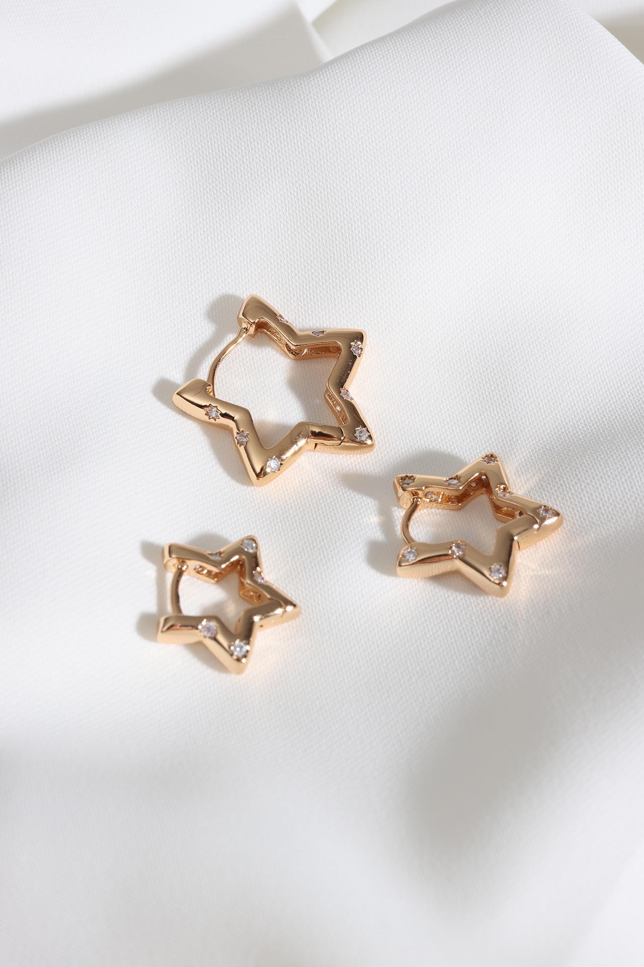 

Серьги из трех частей из стали со звездами золотого цвета