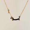 Cartoon Sausage Dog Pendant Necklace for Women - Unique Clavicle Chain, Simple Fall/Winter Sweater Fashion Accessory.
