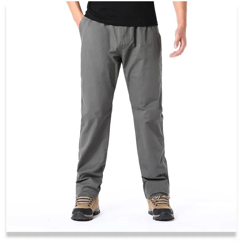 Wiosenne jesienne modne spodnie casualowe dla mężczyzn bawełniane spodnie cargo w jednolitym kolorze z elastyczną talią proste nogawki streetwear męskie spodnie joggers