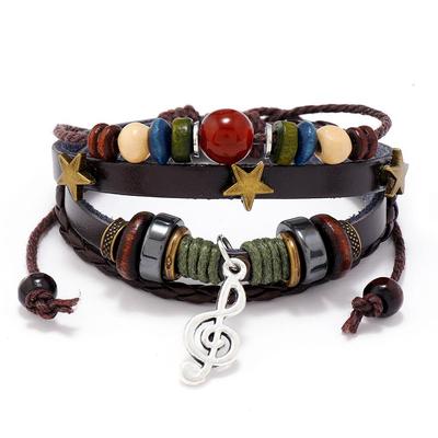 Bracciale in pelle intrecciata con perline, ciondolo in lega, ciondolo in pelle di vacchetta, braccialetto con ciondolo gioielli vintage