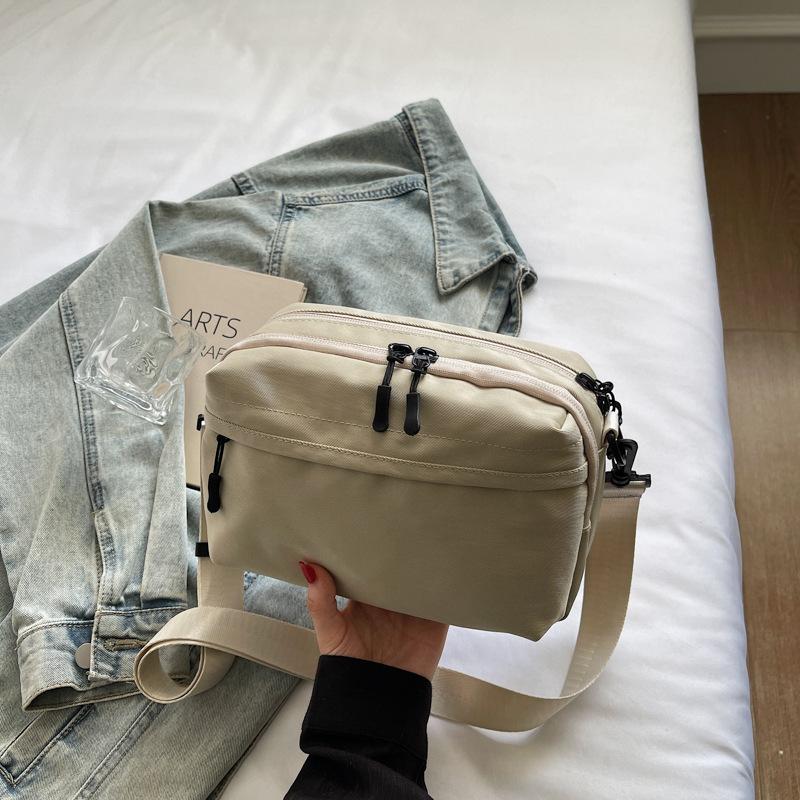 Mobile phone bag simple trend 2025 summer new Japanese lightweight shoulder small backpack women's leisure sports messenger bag