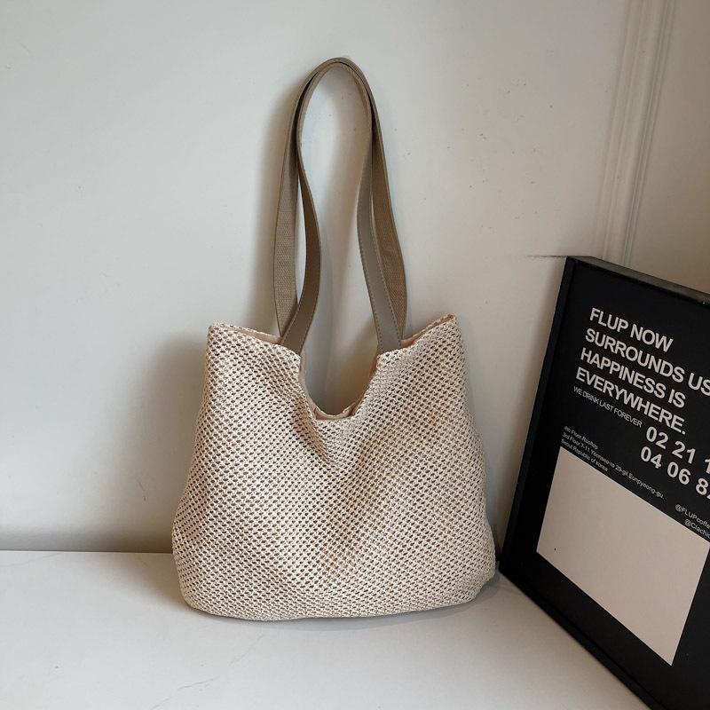 Neue Schulter Baumwollfaden Strohtasche handgefertigte hohle gewebte Tasche Urlaub Strand große Kapazität tragbare Tragetasche Frauen