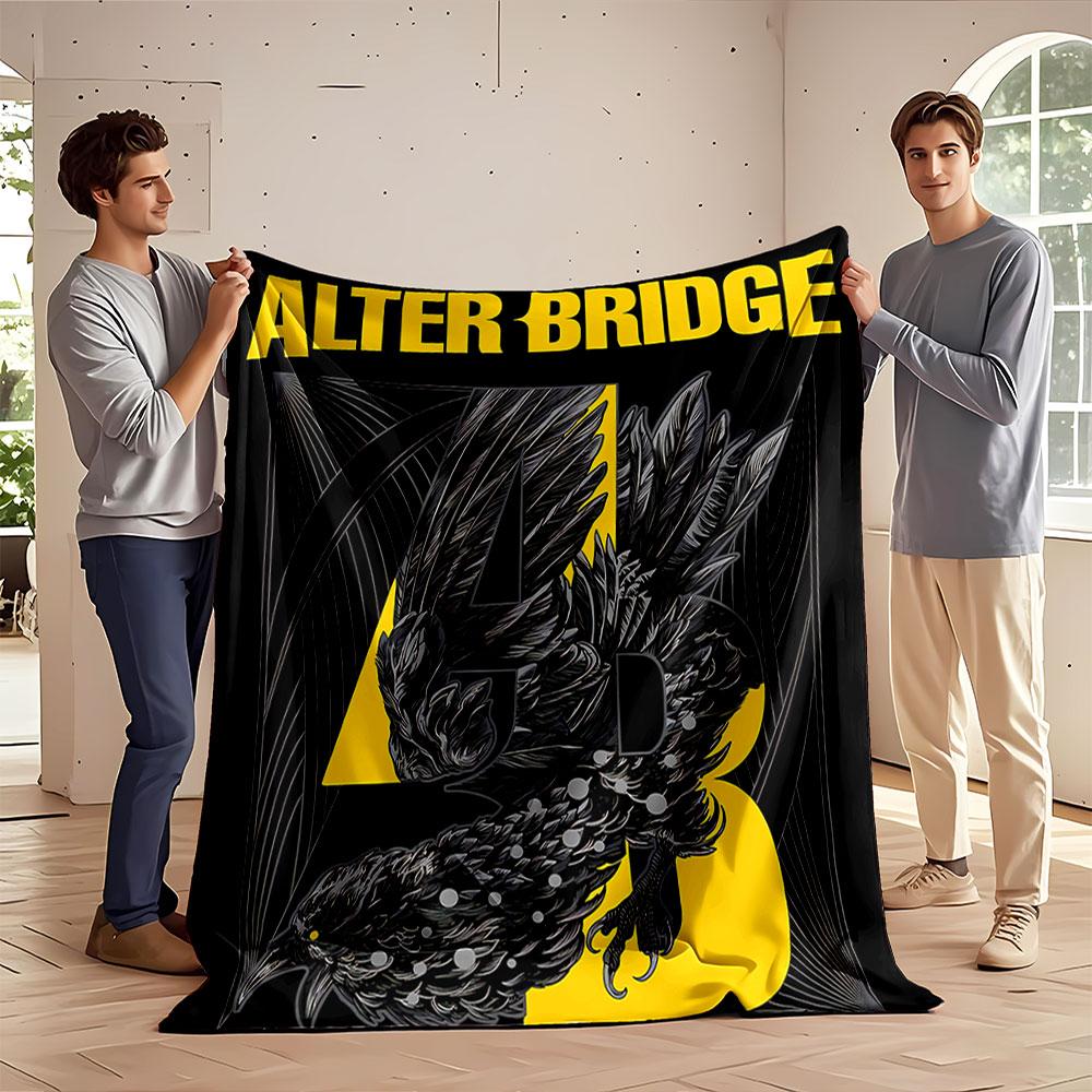 A stylized black bird entwined with yellow text and abstract line art. for all seasons blanket lunch break throw gift