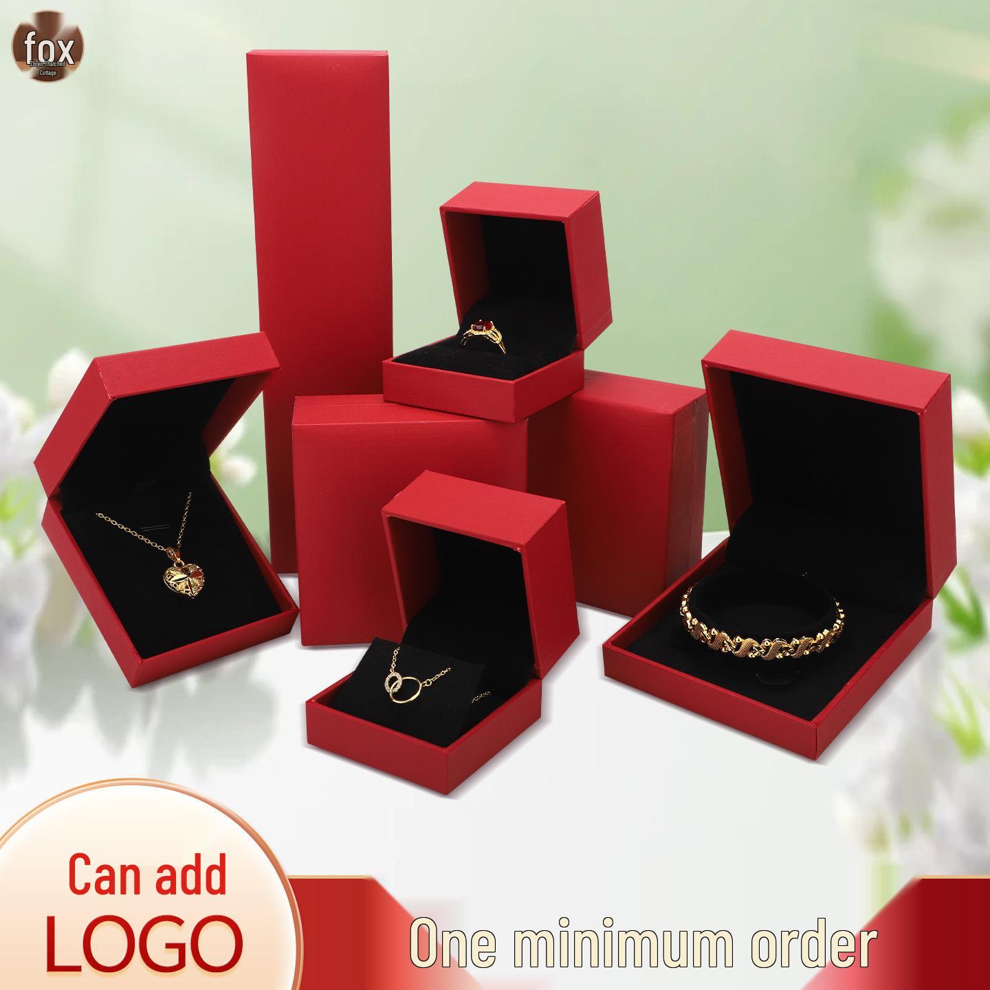 

Red Leather-Grained Jewelry Box for Rings, Pendants, Earrings, and Bracelets with Logo on Black Background Model 00339