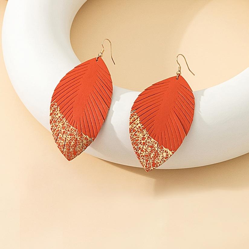 

A pair of stylish and noble blingbling leaf shape earrings are suitable for ladies girls party party vacation помаранчевий