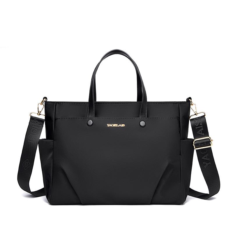 A Laptop Bag, A Lady Carrying A Business Briefcase and Slung A Commuter Tote Bag Across Her Shoulder