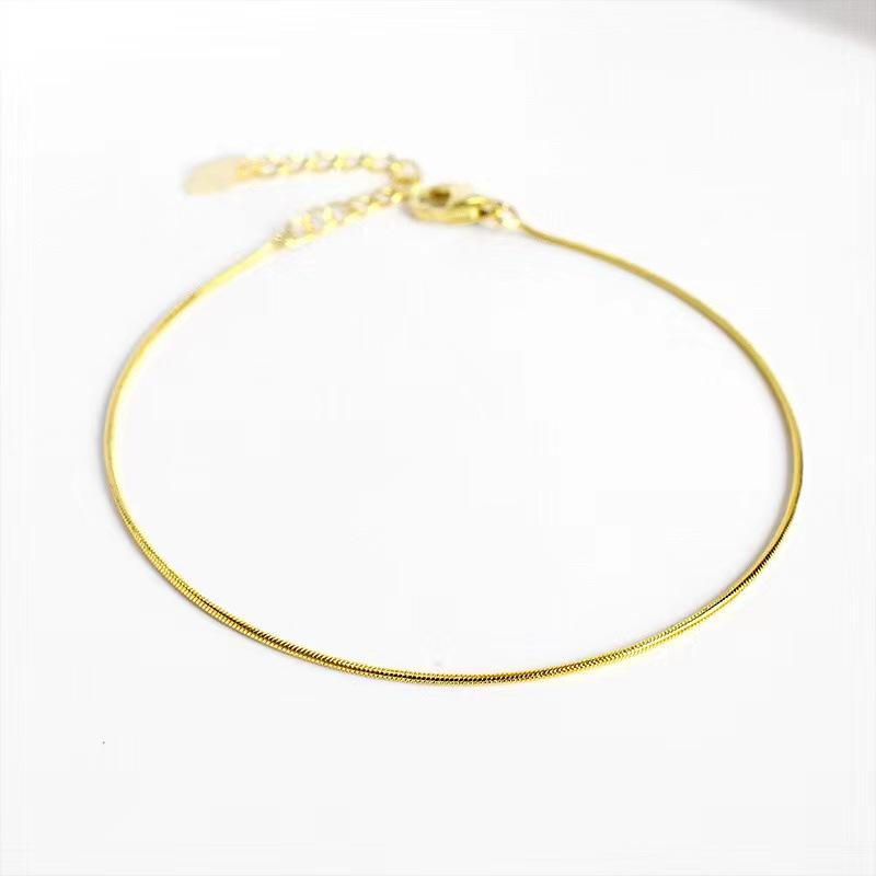 Women's Gold Snake Bone Chain Bracelet/Anklet - 2023 High-End Titanium Steel, Non-Fading, Niche Design.