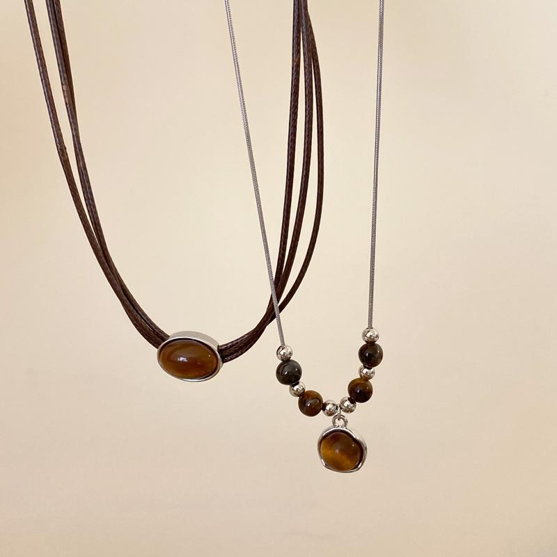 Vintage leather tiger's eye stone pendant necklace women's light luxury niche collarbone chain high-end double-layer stacked sweater chain
