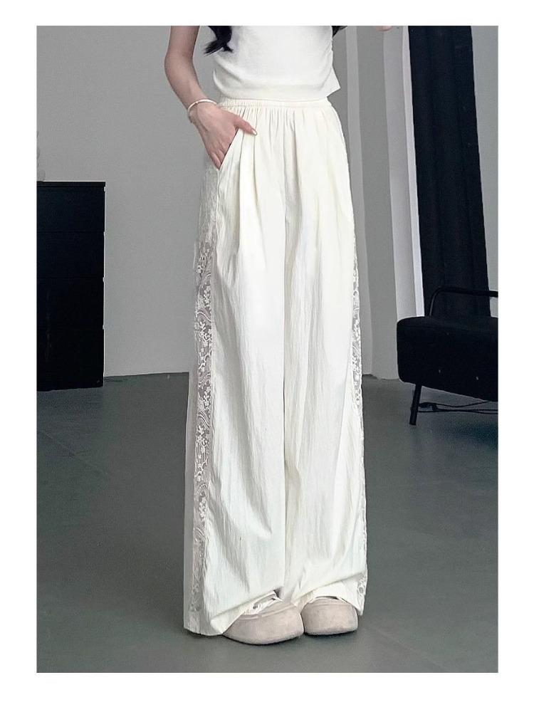 Pantaloni a gamba larga traforati con inserti in pizzo da donna estivi a vita alta con senso del design larghi sottili drappeggiati casual