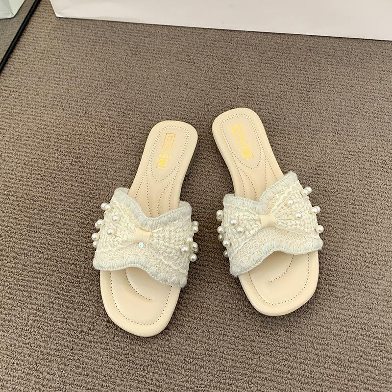 French small fragrant pearl slippers women's summer wear 2025 new fashion and leisure one-word flat-bottomed beach cool slippers