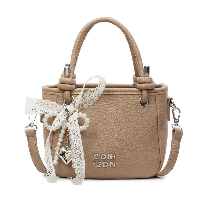 This year, the popular lychee pattern is simple and high-end, portable bucket bag, women's commuting versatile casual style messenger bag