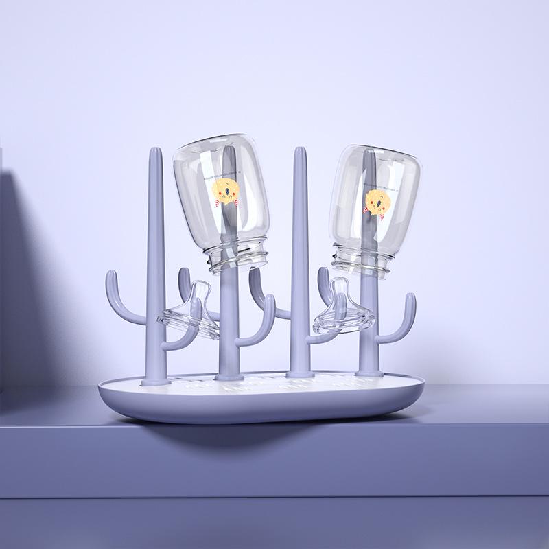 Versatile Baby Bottle Holder & Detachable Drying Rack with Pacifier Slot.