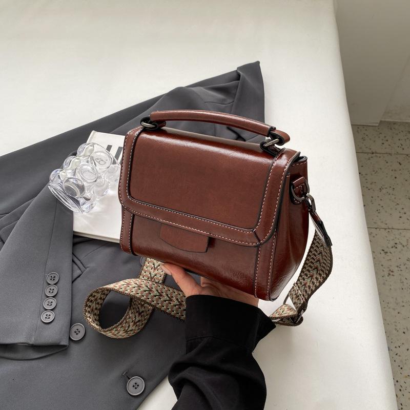 

Retro bag women s 2025 solid color new fashion simple portable shoulder bag casual trend wide shoulder strap small square bag темно-коричневого