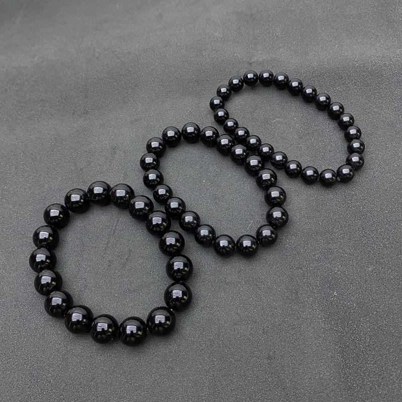 Natürliches Tektitglas Meteoritenarmband mit runden schwarzen Perlen