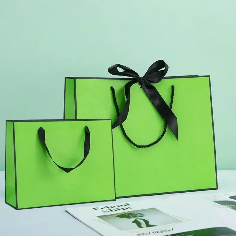 White Paper Jam Handbag Kraft Paper Thick Waterproof Frame Rivet Handle Gift Bag Cosmetic Clothing Store Portable Packaging Bags