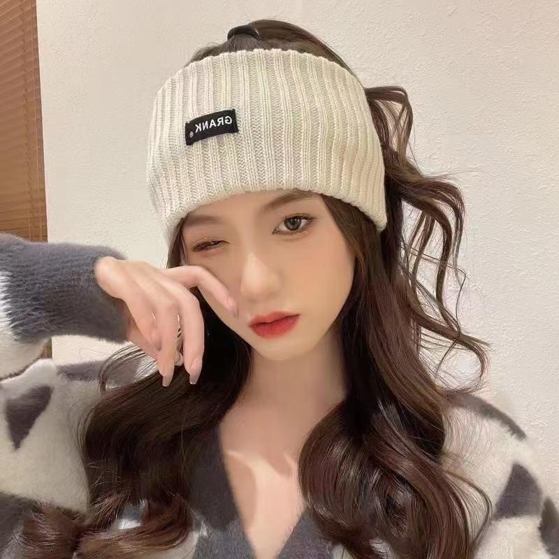 Women's Thick Warm Knitted Winter Hat with Ear Protection - Plush Wool and Pom-Pom Details