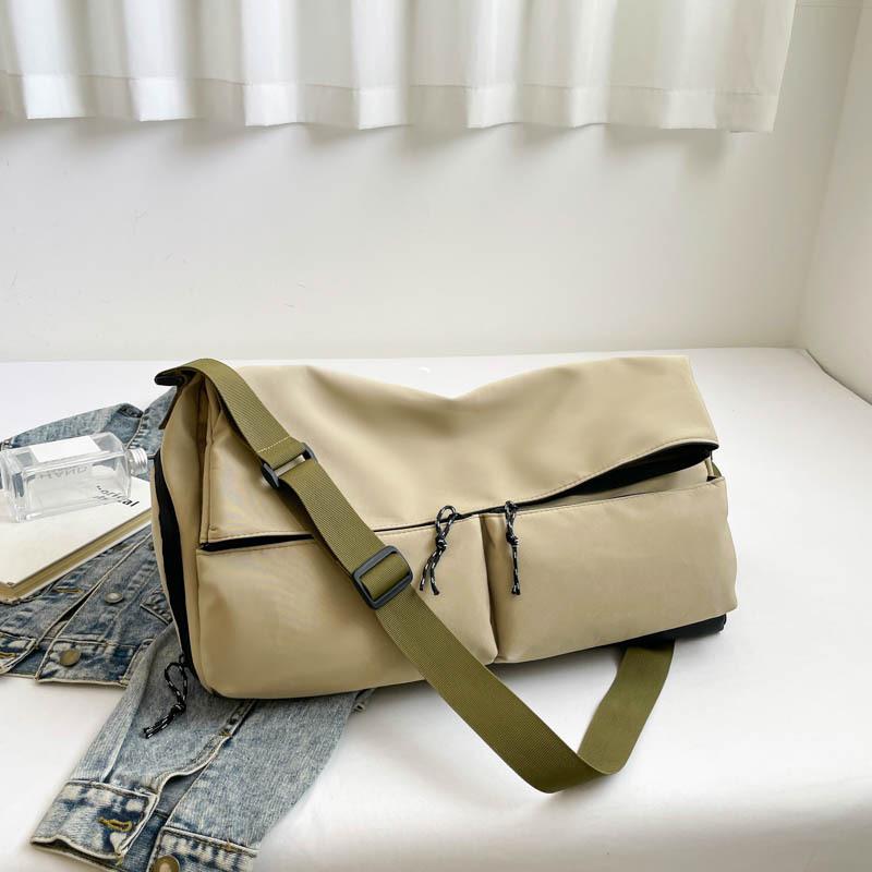 Fashion trend men and women store large bags and go out for leisure and sports versatile solid color simple large capacity shoulder messenger bag