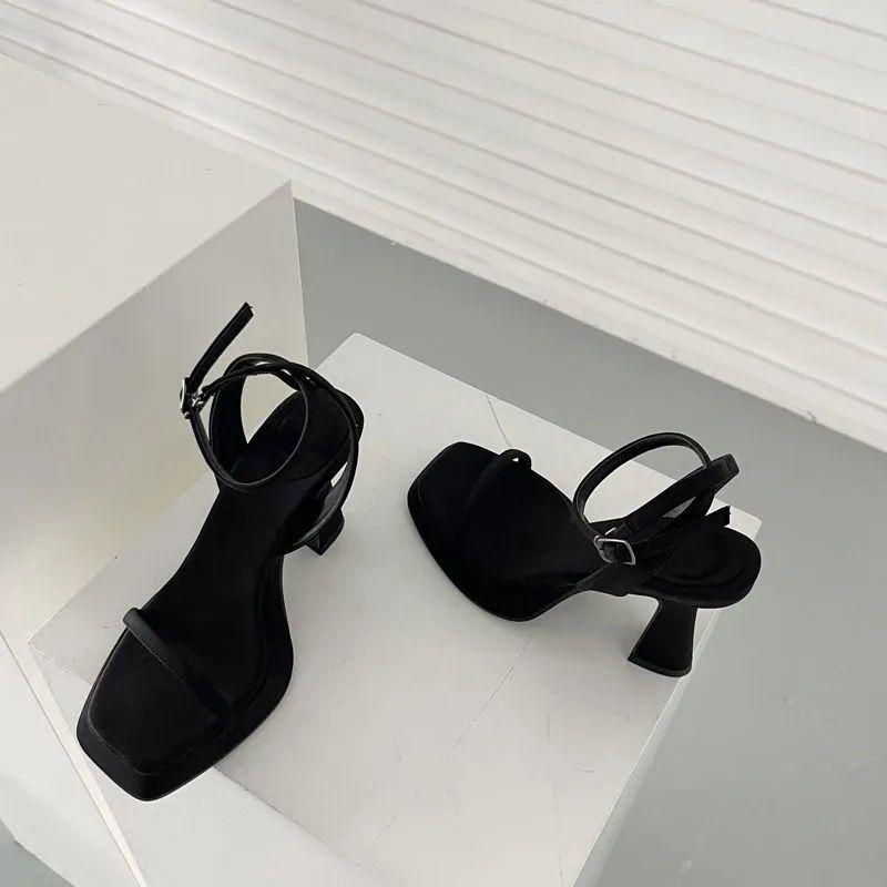 Spring and summer one-word buckle high heels design sense niche pink sexy waterproof table square head sandals women