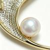 Elegant natural freshwater pearl brooch,with leaf shape, emitting natural luster. Made of copper with zircon accents.