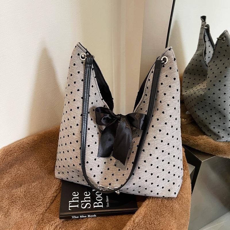 

Canvas bag women s 2025 new large-capacity fashion polka dot shoulder bag versatile commuter bow tote bag