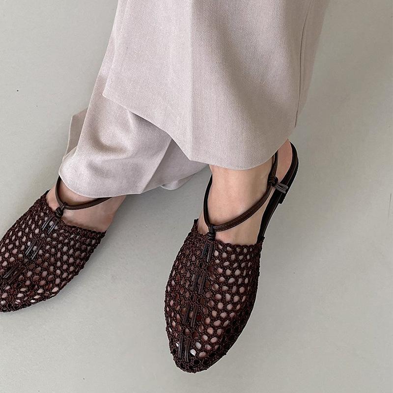 Sheepskin summer new niche woven Roman shoes one-word buckle flat bottom fishing net bag head sandals women wear half slippers