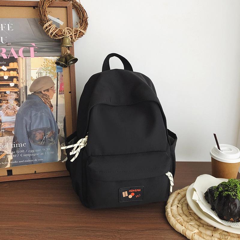 New casual simple solid color backpack large capacity junior high school student schoolbag