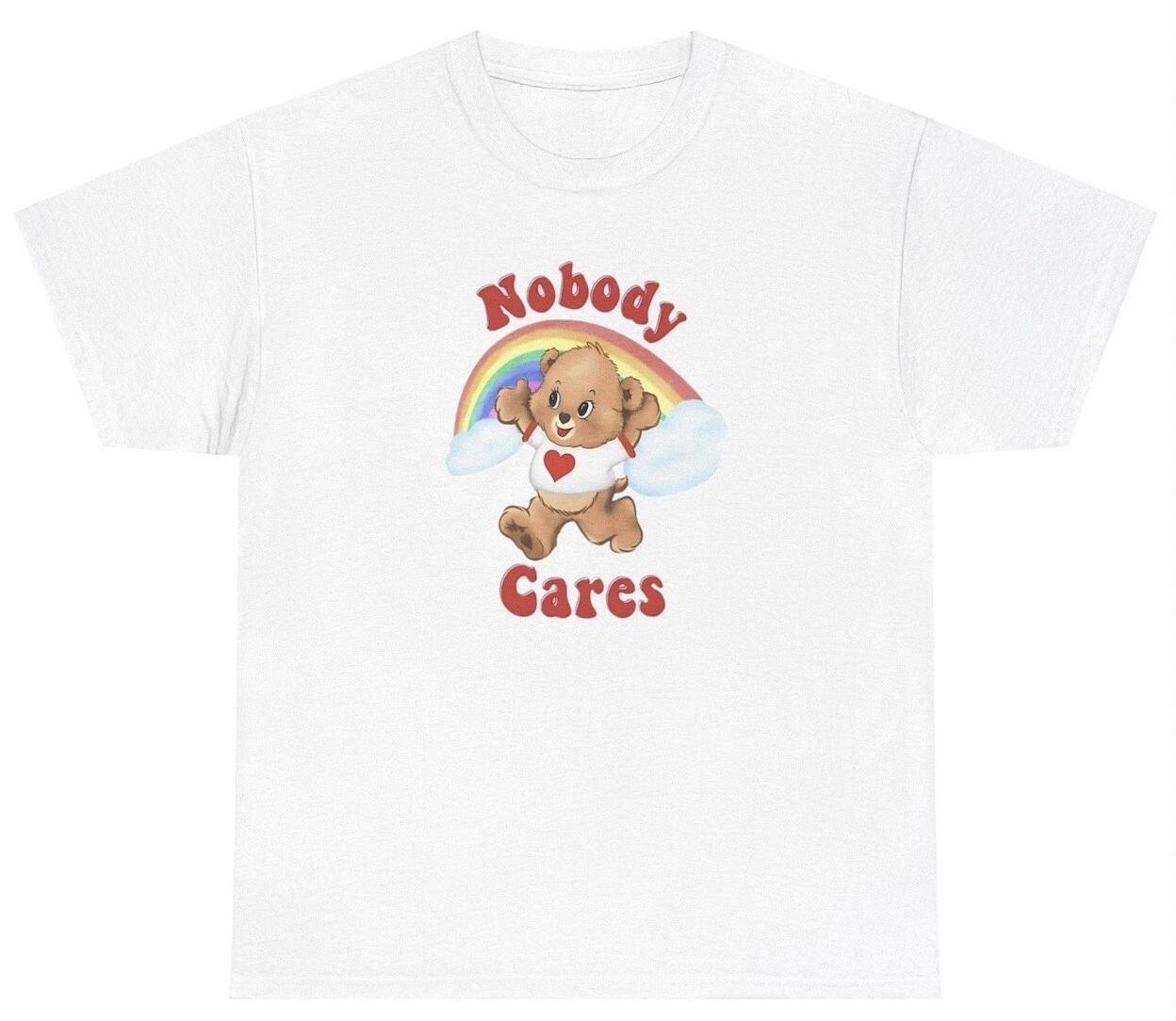 

Nobody Cares Bear T Shirt Funny Lolly The Bear Pun Y2K Meme Joke Ironic Gag Gift 4XL