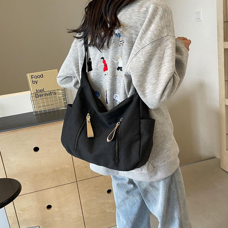 Shoulder bag women's large capacity 2025 new solid color versatile Korean version casual large capacity messenger bag canvas dumpling bag