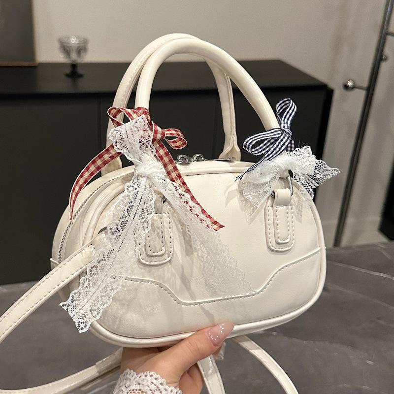Frühling 2025 neu Ou Ruofeng Koreanische Version von einfacher tragbarer Boston-Tasche Nische lässig vielseitige Umhängetasche Tasche Damen