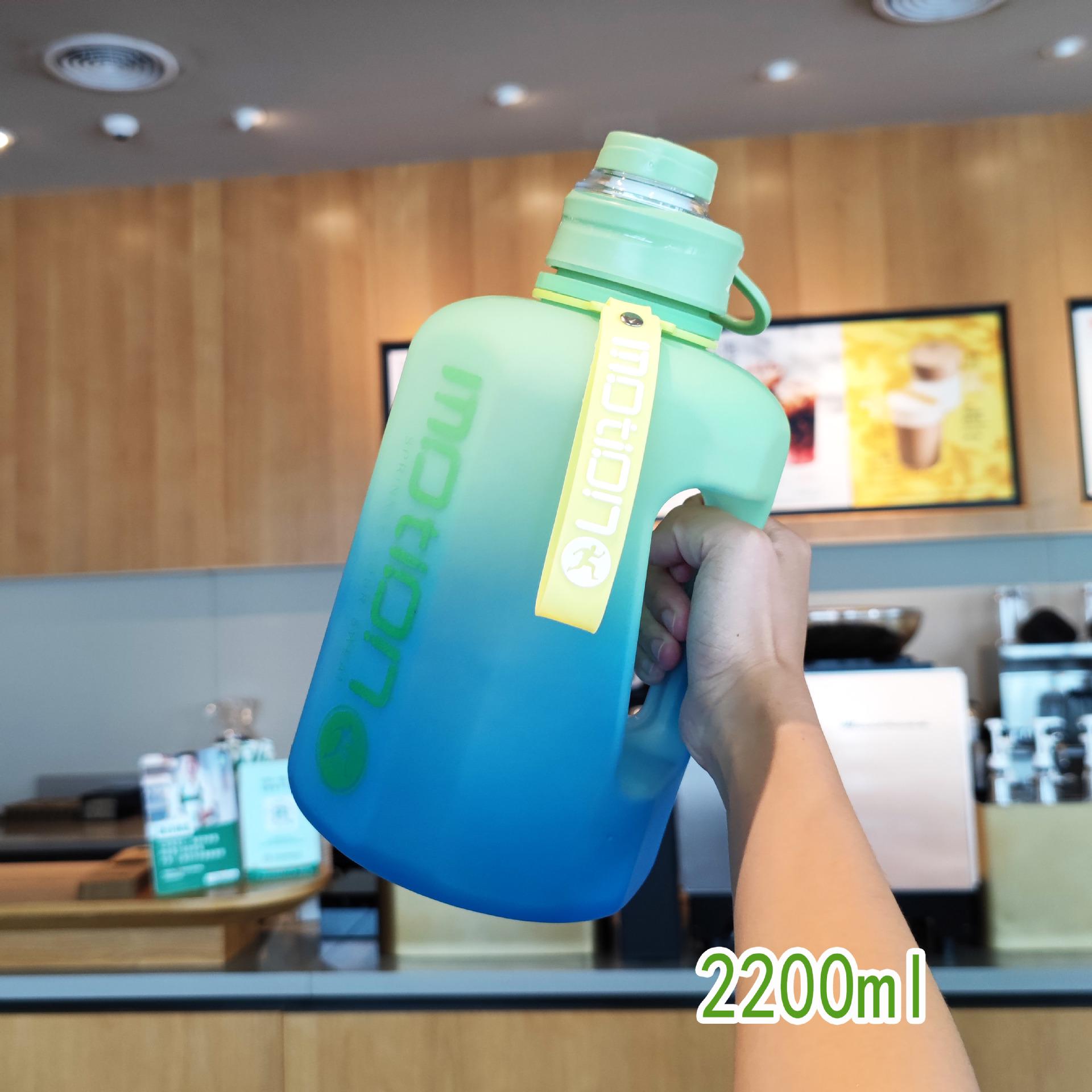 Large Capacity Gradient Sports Water Bottle with Handle and Hexagonal Design 2200ml