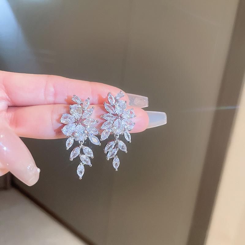 Silver Needle Cubic Zirconia Feather Dangle Earrings - Retro High-End Style, Niche Exaggerated Design for Women.