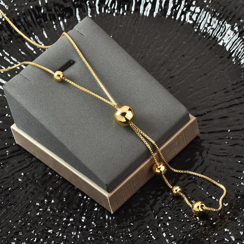 

Chic Titanium Steel Pullthrough Ball Necklace For Women Ideal For Fashion Forward Looks Gold Bead Necklace