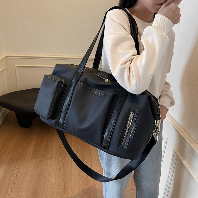 Women's outgoing travel bag Fashion large-capacity portable business trip duffel bag High value lightweight sports fitness bag Men's