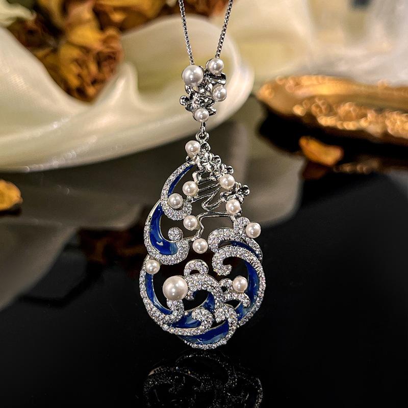 

Ювелирное ожерелье Ювелирные изделия Жемчуг Эмаль Ручная работа Капающее масло Высокий класс Роскошный Женский