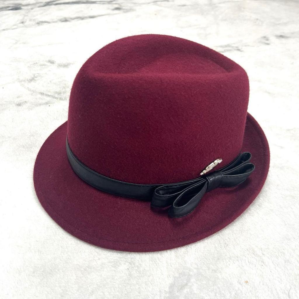 Used STETSON maxim burgundy wool hat with black ribbon and feather decoration